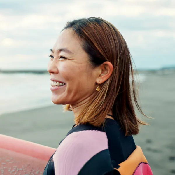 Woman smiling by the ocean